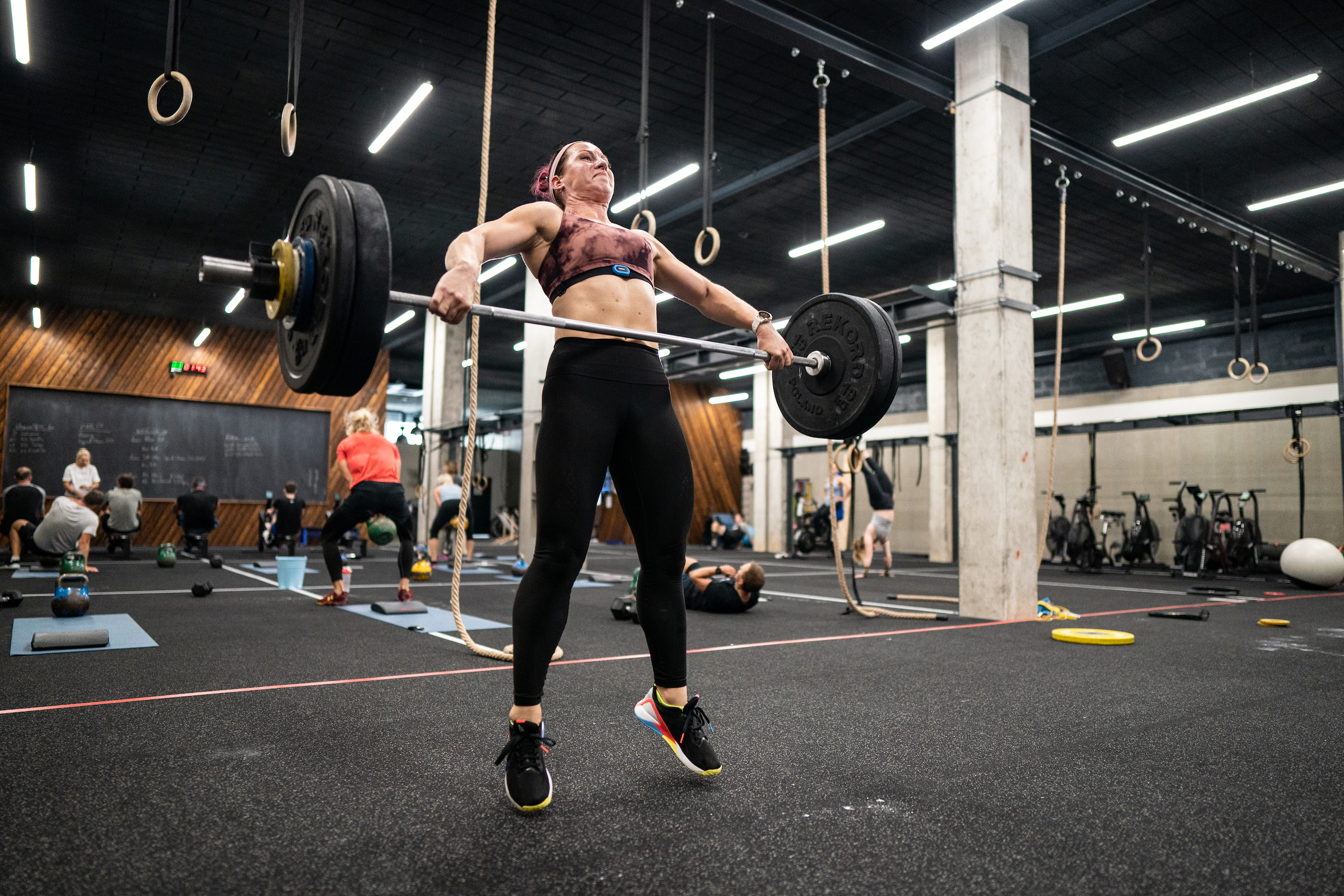 An athlete performs the barbell snatch.