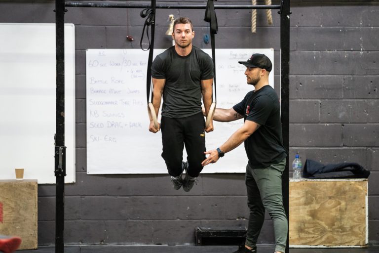 Athlete at the top of a dip on the rings